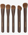A selection of five brown makeup brushes to choose from with synthetic brown bristles and brown handles, labeled with their intended use.