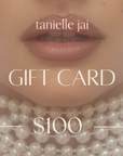 An electronic gift card from tanielle jai with a $100 value, displaying the brand's logo and a $100 denomination.