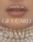 tanielle jai - Gift Card in gallery position 1 featuring soft lips adorned with layered pearl necklaces and subtle lighting