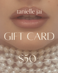 tanielle jai - Gift Card in gallery position 1 featuring soft lips adorned with layered pearl necklaces and muted tones