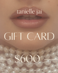 tanielle jai - Gift Card in gallery position 1 featuring close-up of lips with layered pearl necklace and soft makeup