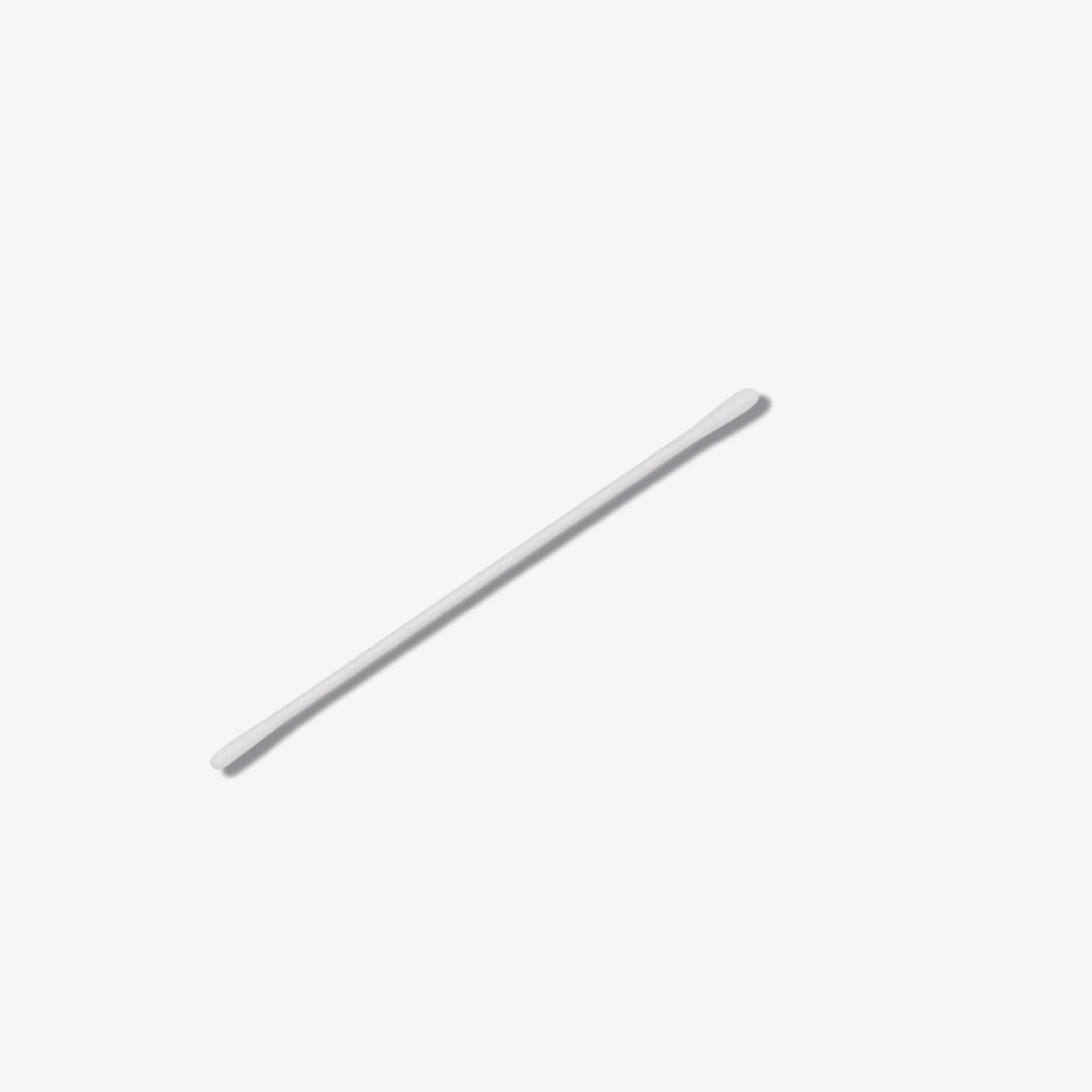 A single precision rounded cotton tip on a white background