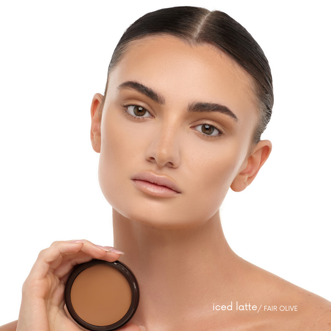 BRONZOUR CREAM BRONZER in iCED LATTE on a model with a fair olive skintone.