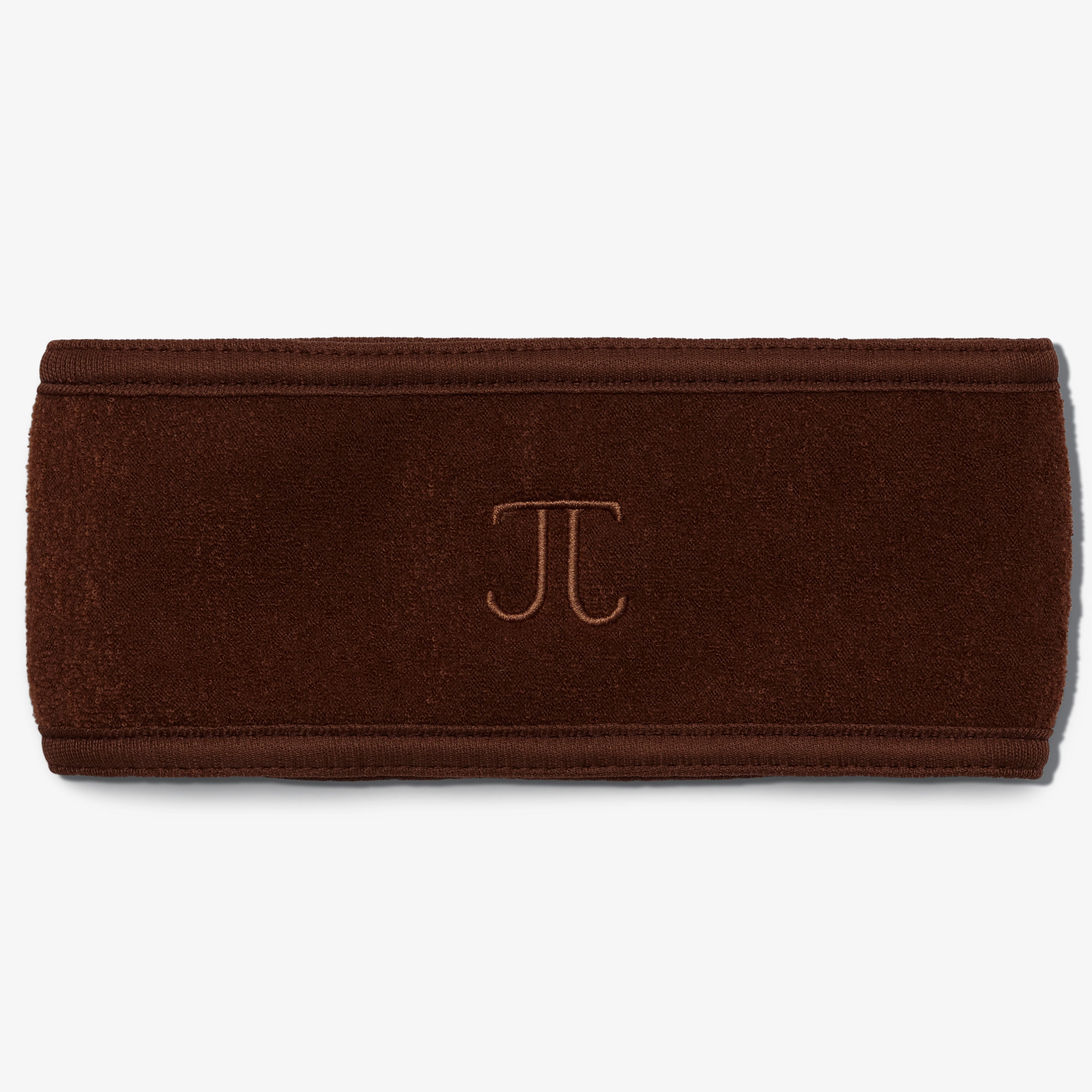 A brown terry headband with a velcro closure, displaying the embroidered monogram 'TJ in the center.