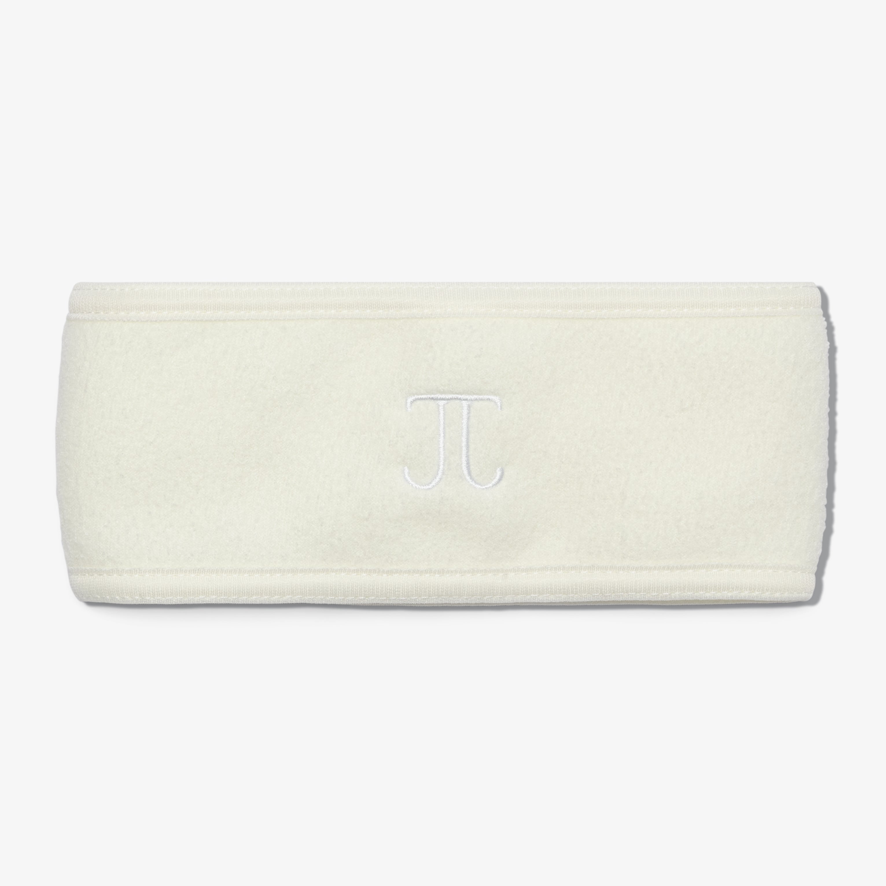 A terry headband with a velcro closure, displaying the embroidered monogram 'TJ in the center.