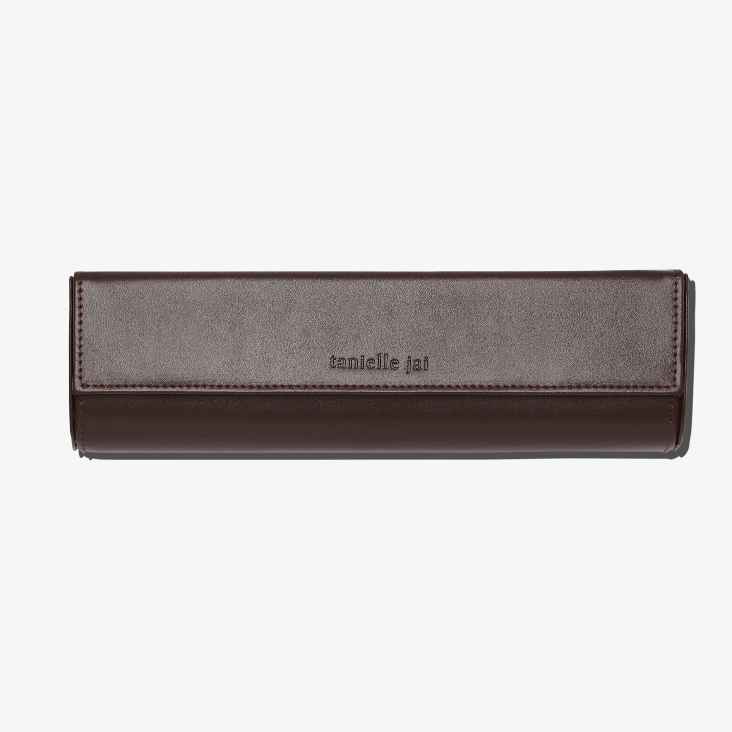 Tanielle Jai Vegan leather brush clutch with magnetic closure.