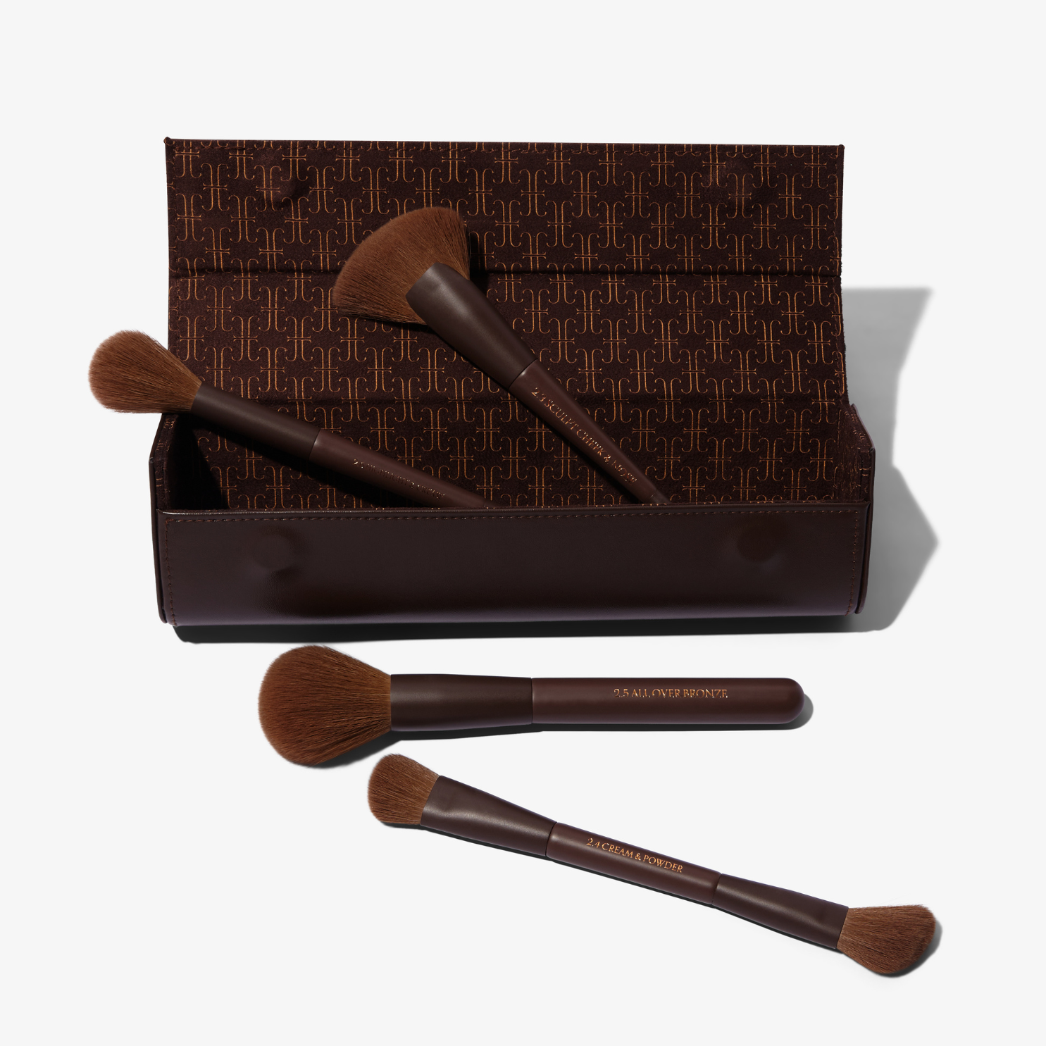 Tanielle Jai Vegan leather brush clutch with magnetic closure open, displaying four iconic VOL.2 Brushes