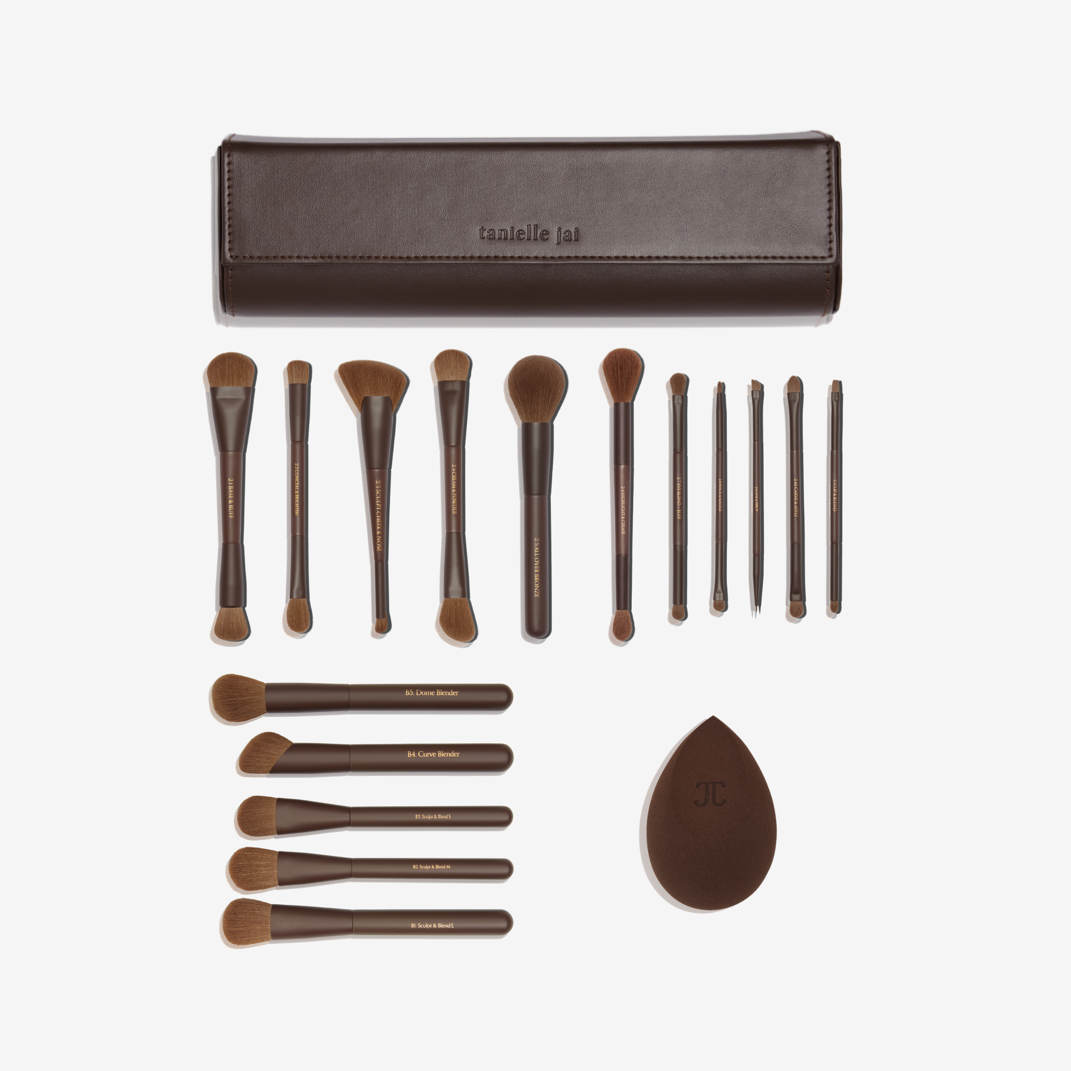 A collection of chocolate brown makeup brushes with a matching vegan leather clutch, displayed on a white background. And a brown beauty sponge.