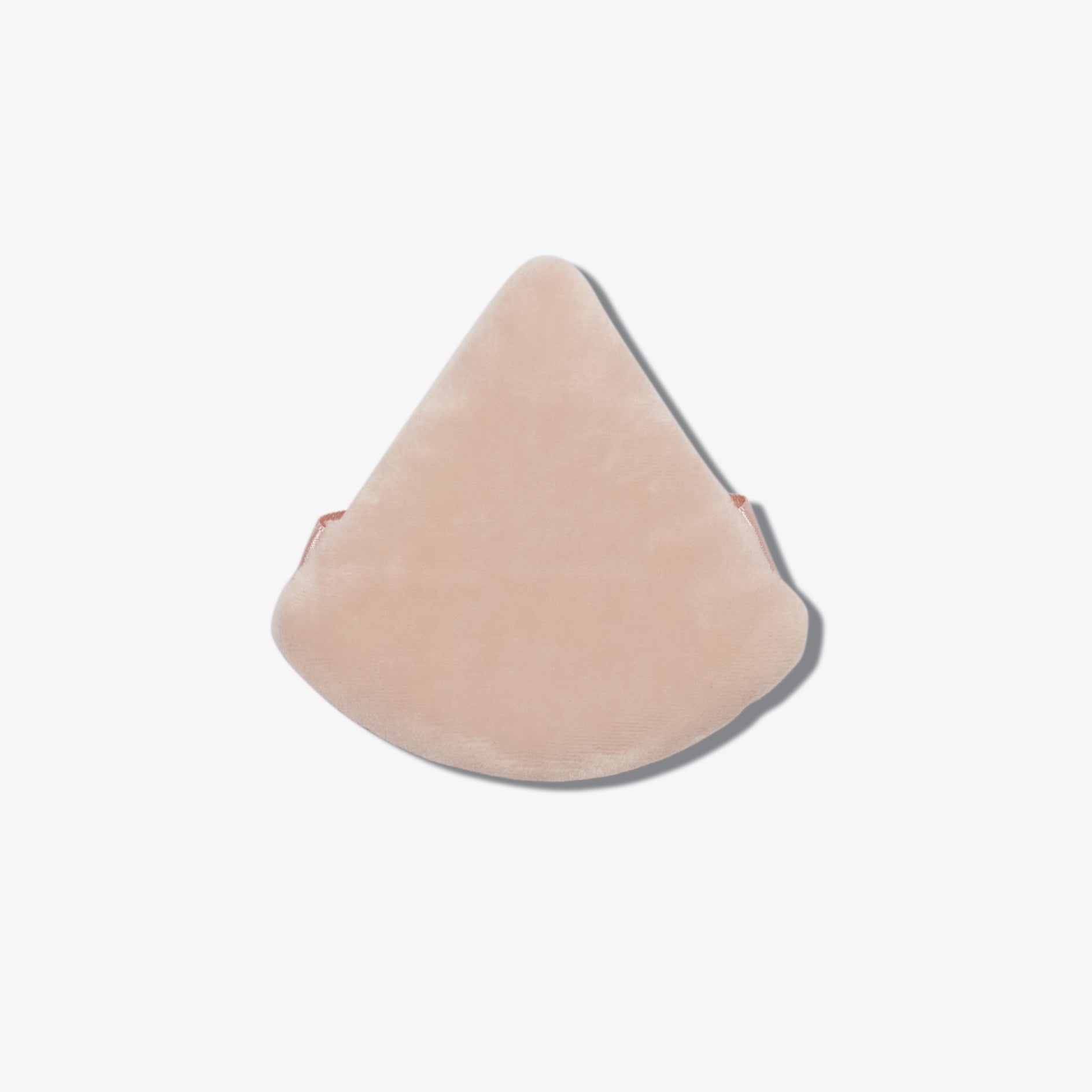 Underside view of the TJ triangular pink velvet powder puff.