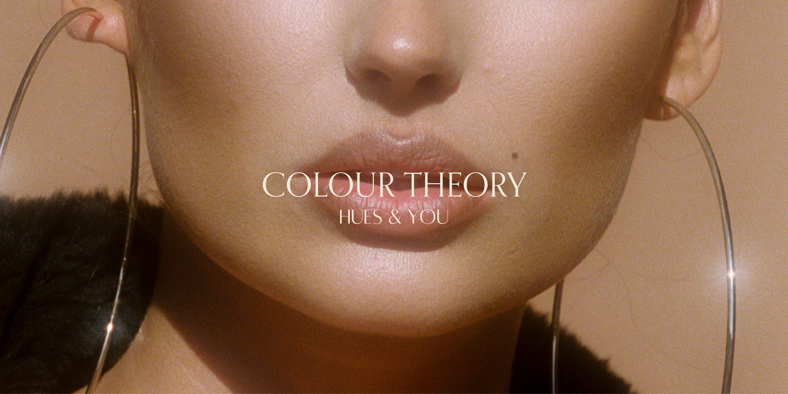 Promotional image featuring a close-up of a person's lower face with the text 'COLOUR THEORY HUES & YOU' overlayed, indicating the course content related to makeup and color theory.